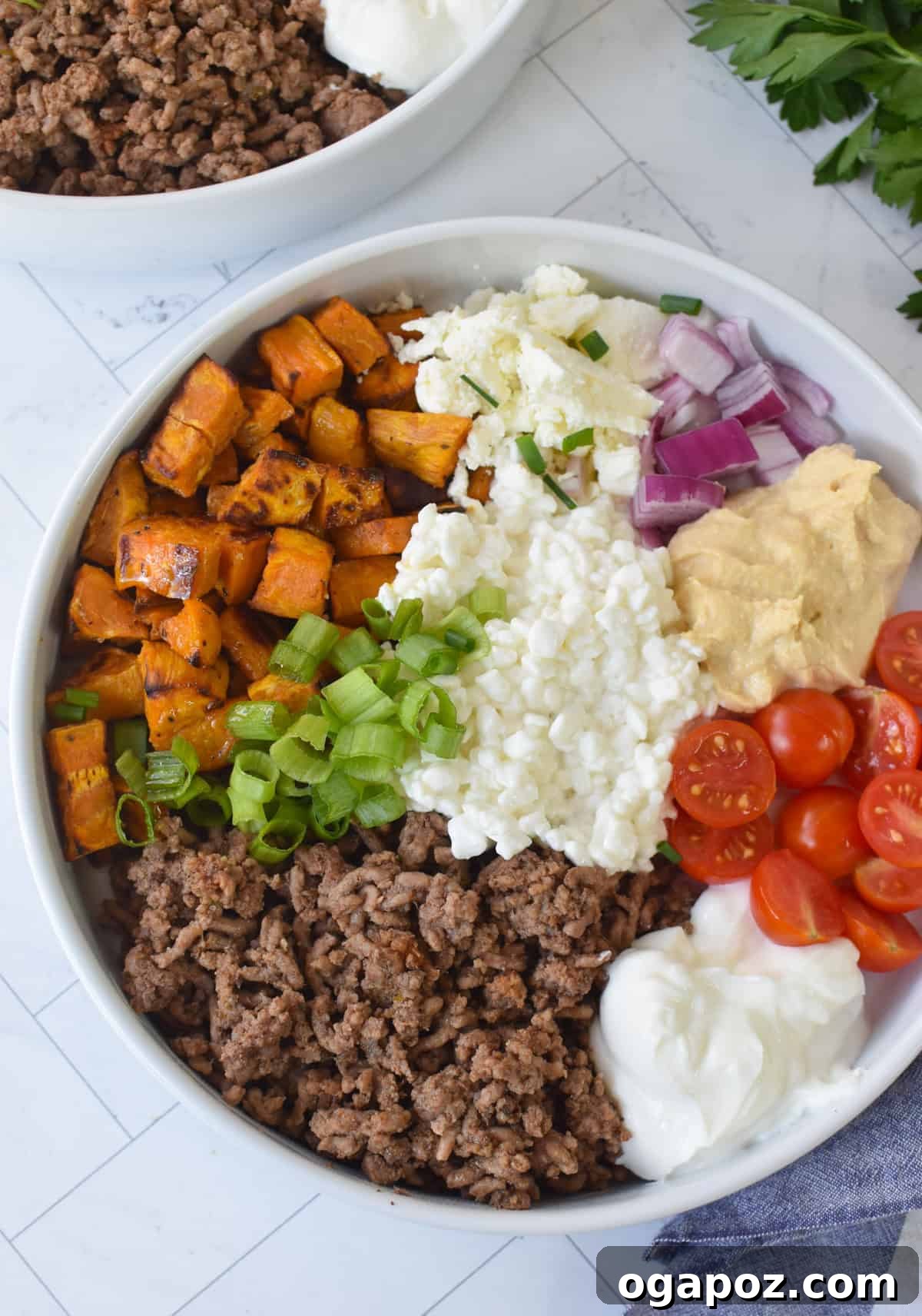 Ground Beef Sweet Potato Cottage Cheese Bowls 5 A beautifully arranged Sweet Potato Cottage Cheese Bowl, showcasing all its colorful garnishes.