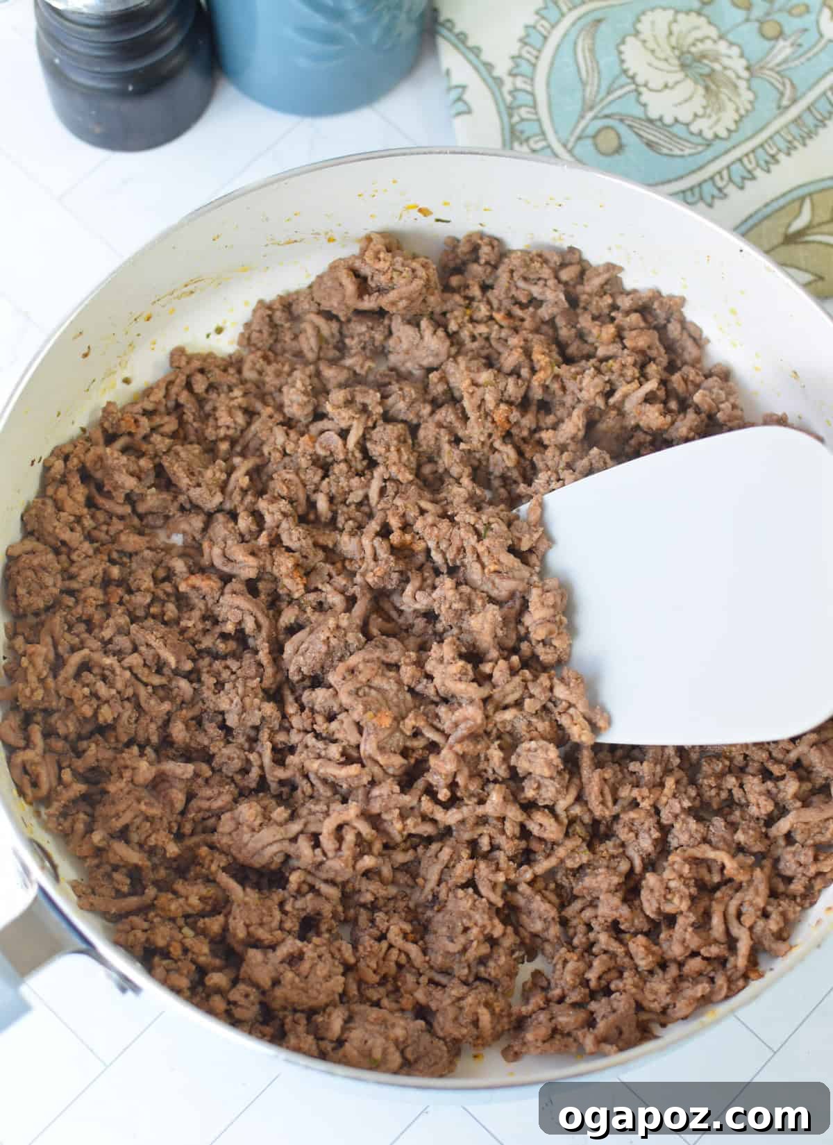 Ground Beef Sweet Potato Cottage Cheese Bowls 7 Ground beef cooking in a skillet with onions and garlic, part of the Sweet Potato Cottage Cheese Bowls preparation.