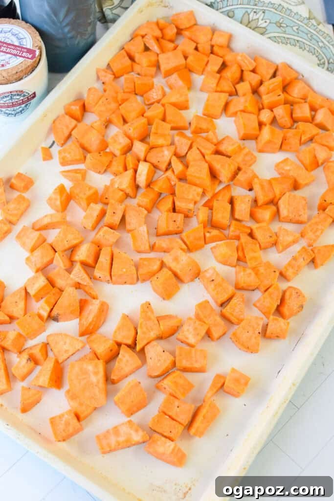 Ground Beef Sweet Potato Cottage Cheese Bowls 9 Sweet potato cubes roasting on a baking sheet, golden and tender.
