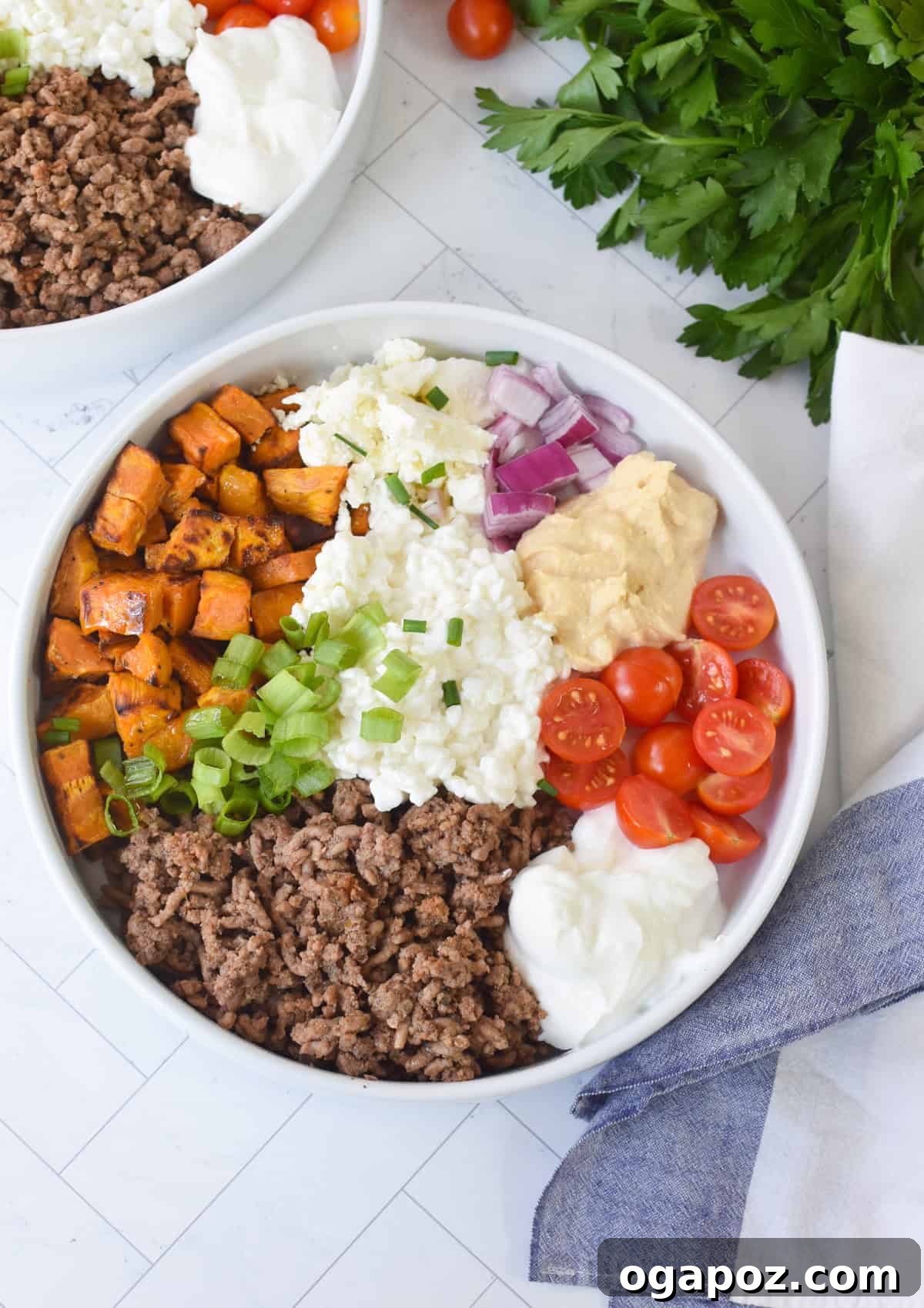 Ground Beef Sweet Potato Cottage Cheese Bowls 10 A completed Sweet Potato Cottage Cheese Bowl, garnished and ready to enjoy, with a neat napkin alongside.