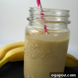 Finished Mango Banana Oatmeal Breakfast Smoothie in a glass, ready to drink.