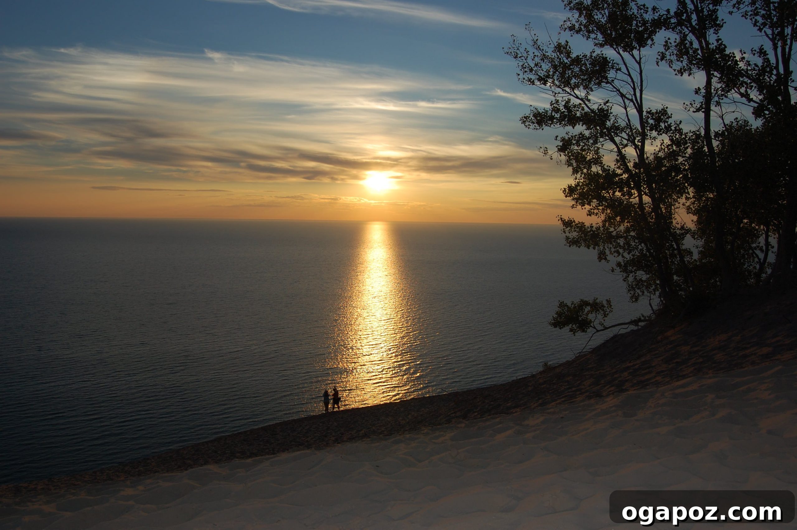 Vibrant Lake Michigan Sunset Another stunning image of the sunset at Sleeping Bear Dunes, emphasizing the dramatic sky and serene landscape.