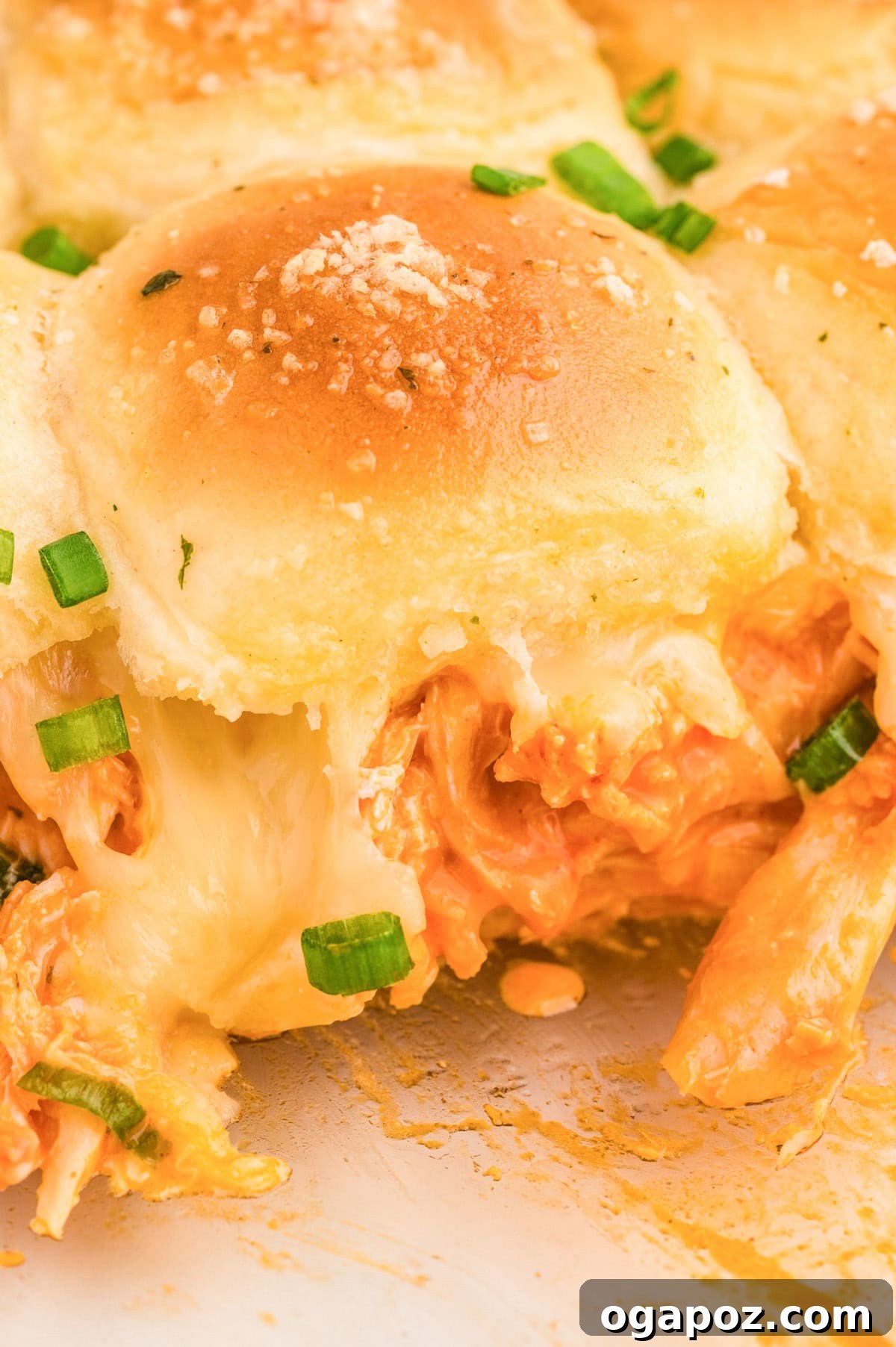 Ultimate Buffalo Chicken Sliders 2 Easy Buffalo Chicken Sliders on a plate with fresh green onions