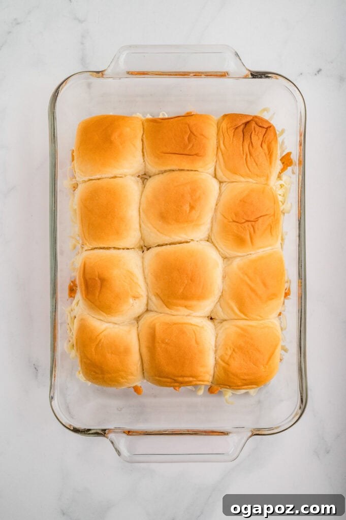 Ultimate Buffalo Chicken Sliders 8 Easy Buffalo Chicken Sliders assembled in a pan, ready for baking