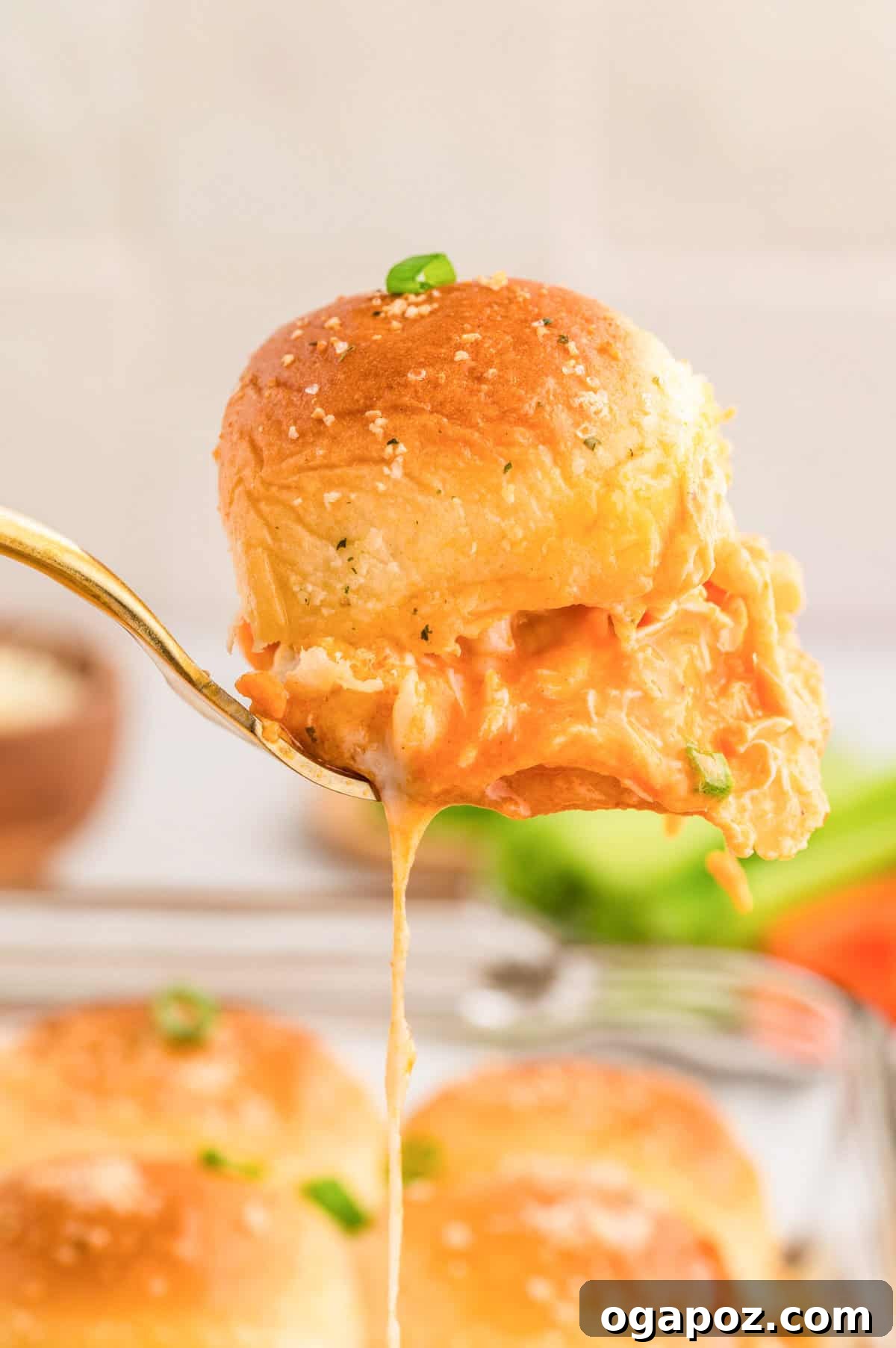 Ultimate Buffalo Chicken Sliders 10 Easy Buffalo Chicken Sliders on a serving spoon