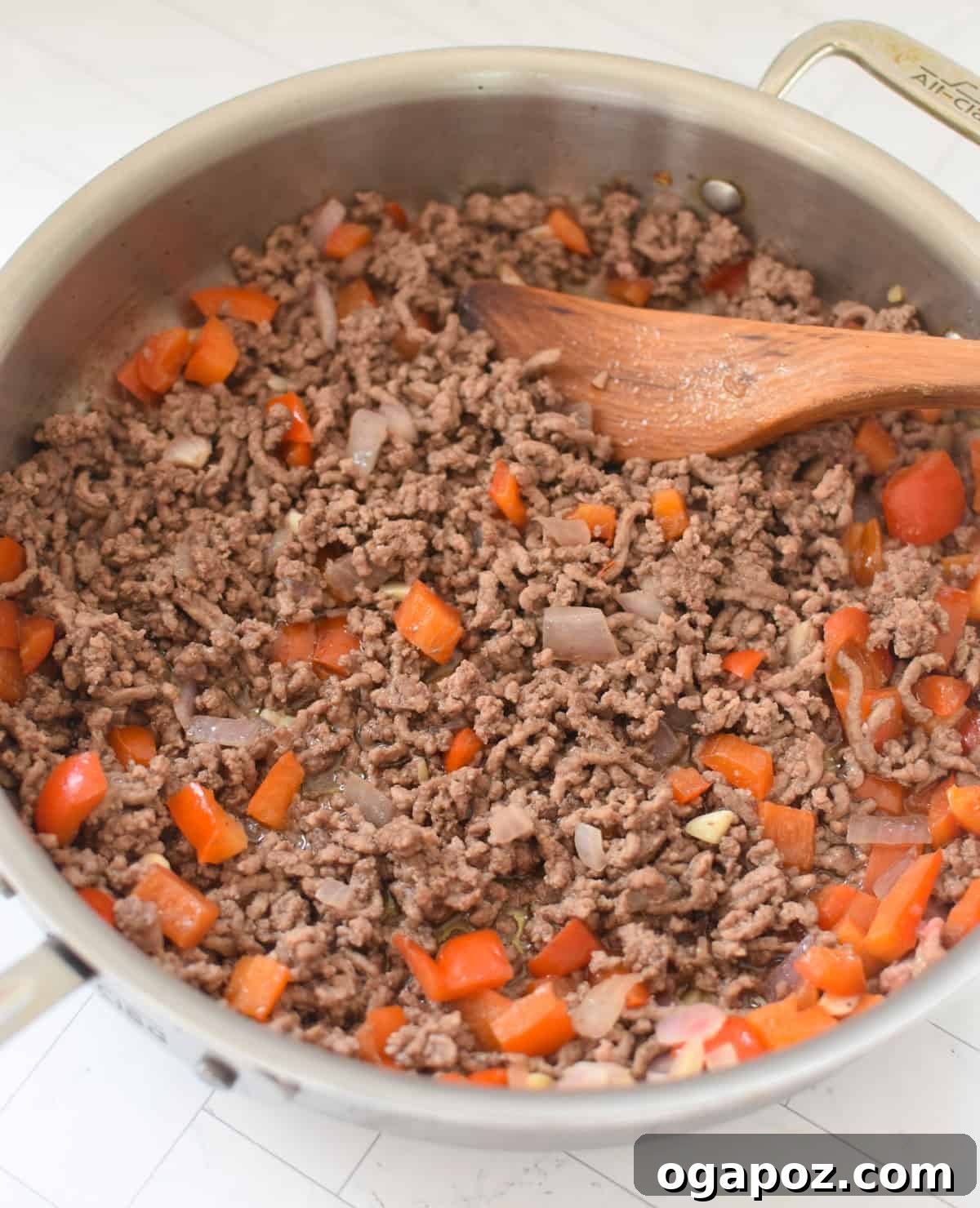 Rustic Mediterranean Beef and Cabbage Stir-fry 8 Ground beef and sautéed vegetables in a skillet during the cooking process of Mediterranean Beef and Cabbage Stir-fry.