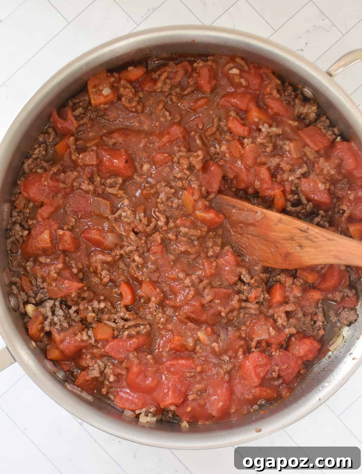 Rustic Mediterranean Beef and Cabbage Stir-fry 9 Mediterranean Beef and Cabbage Stir-fry in a skillet with a rich sauce developing.