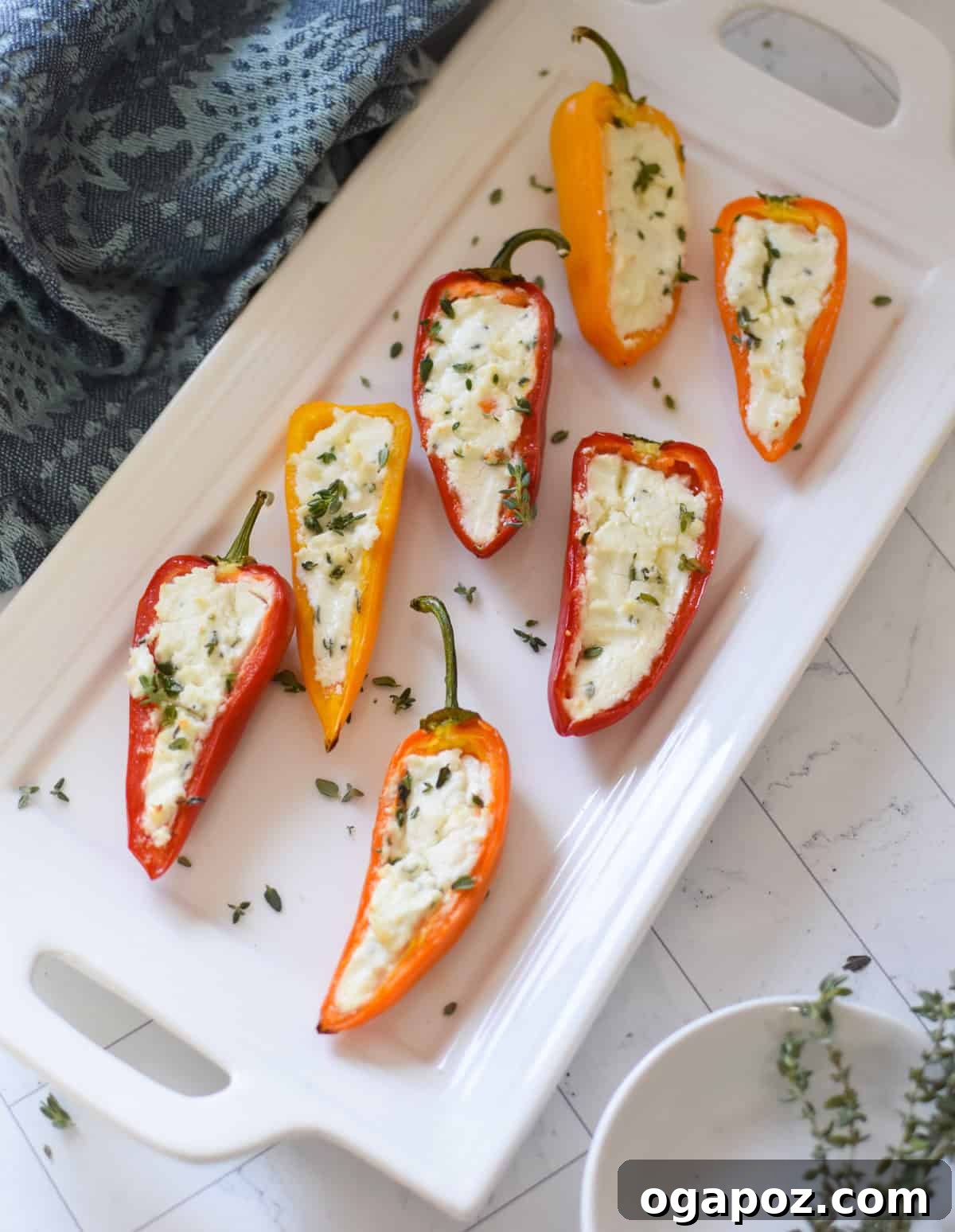 Creamy Goat Cheese Stuffed Mini Peppers 13 Mediterranean Stuffed Mini Peppers Appetizer displayed on a platter, garnished beautifully