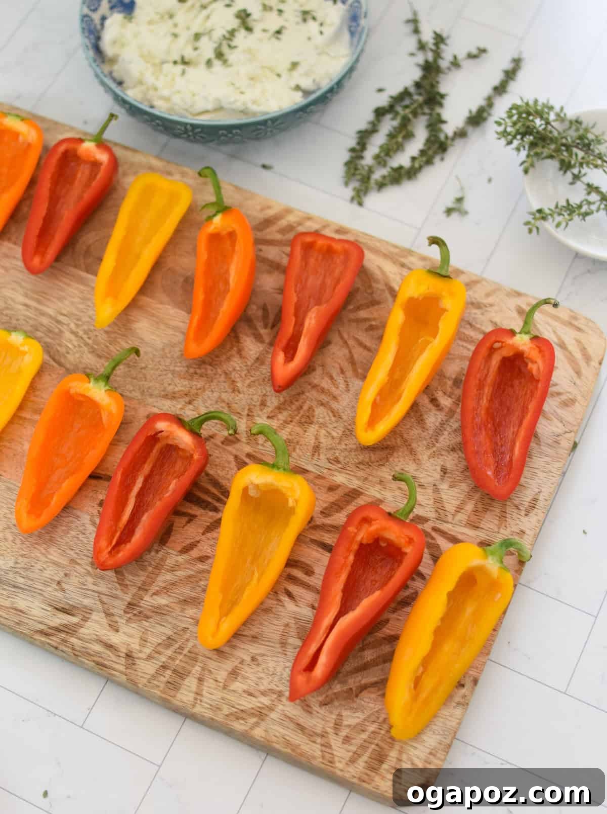 Creamy Goat Cheese Stuffed Mini Peppers 9 Prepared mini sweet peppers, cut in half and seeded, on a cutting board