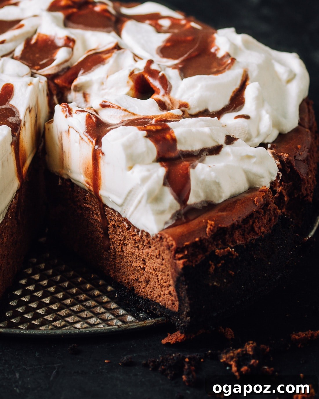 Decadent Chocolate Cheesecake 2 Rich and creamy chocolate cheesecake with a chocolate wafer crust and whipped cream topping.