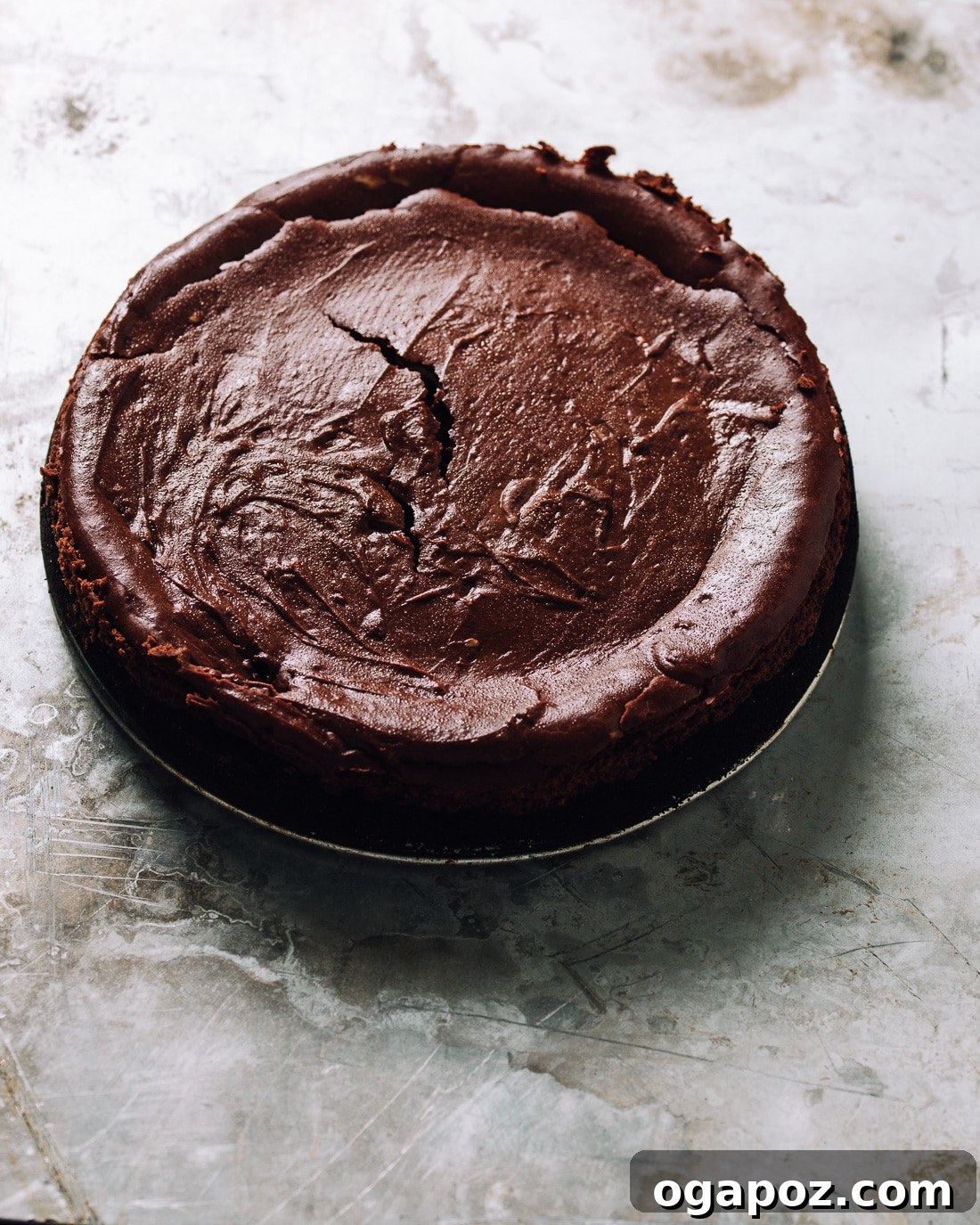 Decadent Chocolate Cheesecake 6 A smooth, unbaked chocolate cheesecake batter in a springform pan, ready for the oven.