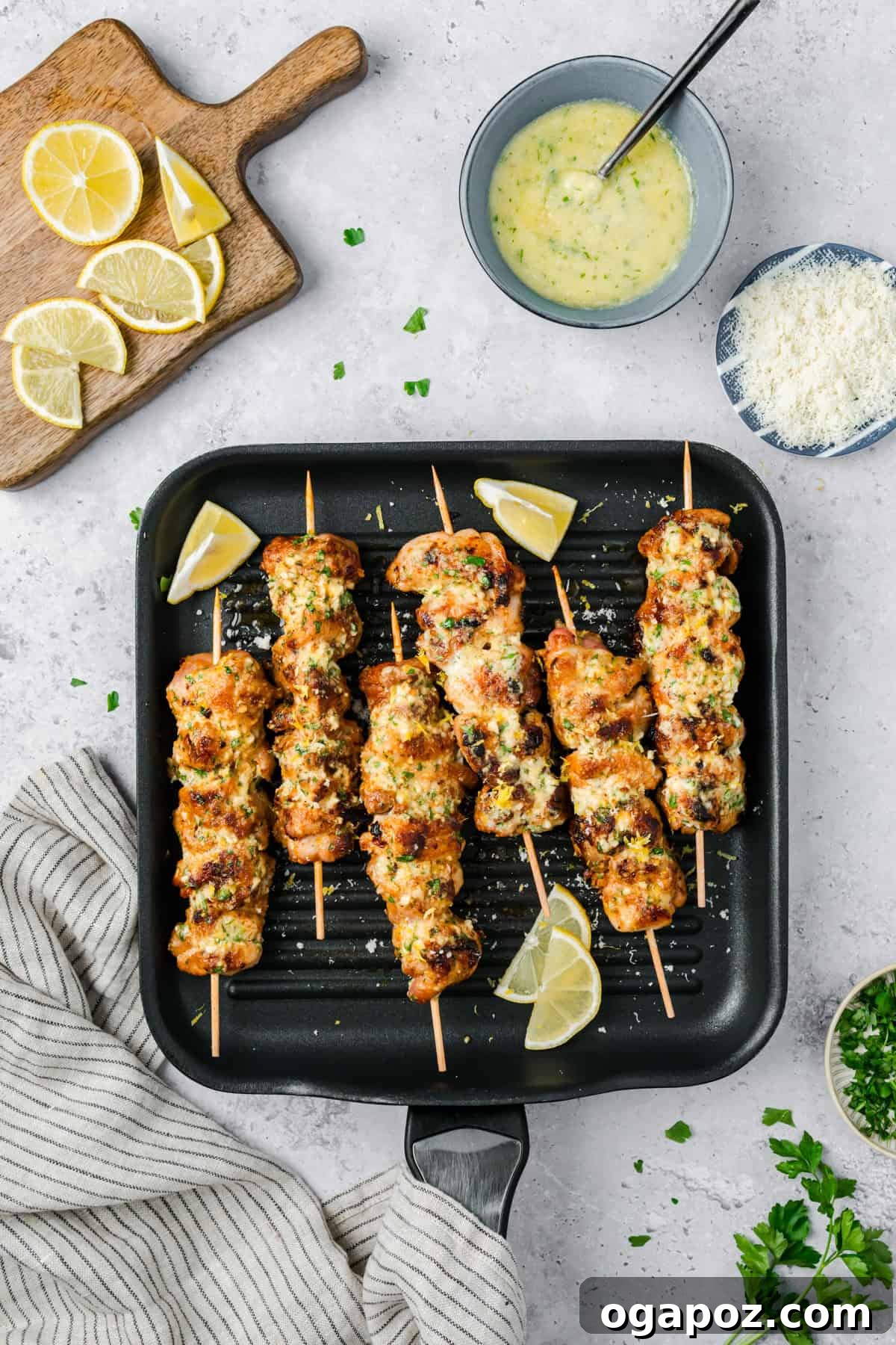 Golden Garlic Parmesan Chicken Skewers 10 Chicken skewers cooking on a grill pan.