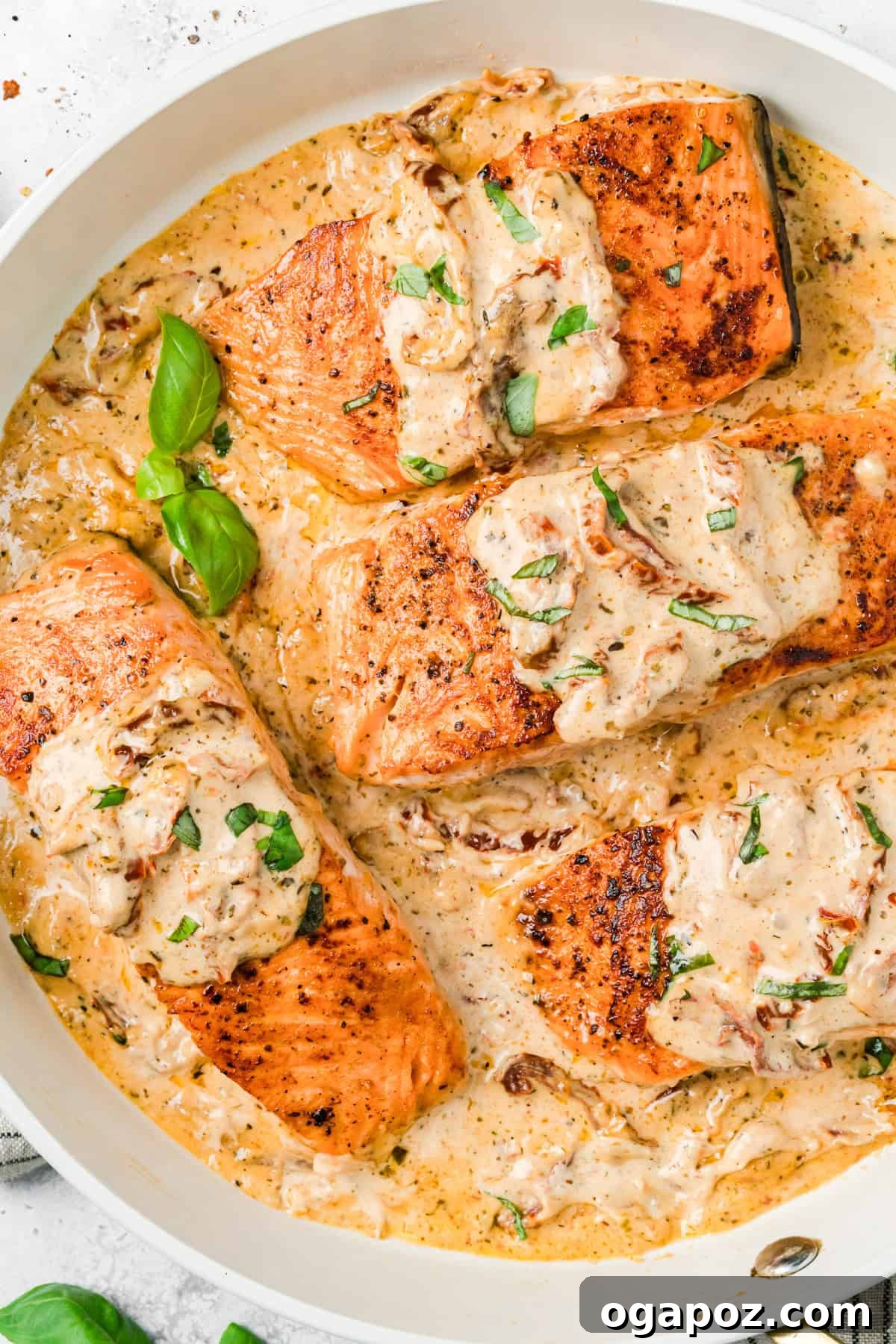 Engagement Salmon 2 Marry Me Salmon in a skillet with fresh basil garnish
