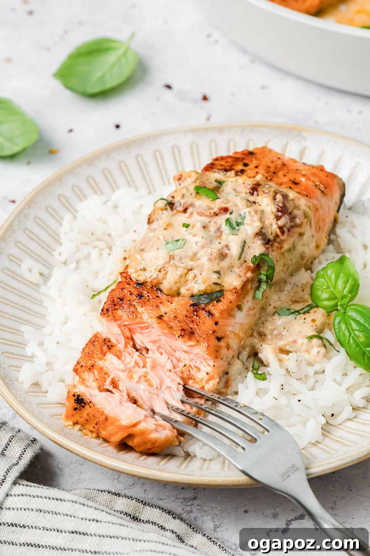 Engagement Salmon 11 Marry Me Salmon on a plate with a fork flaking the salmon to show tenderness