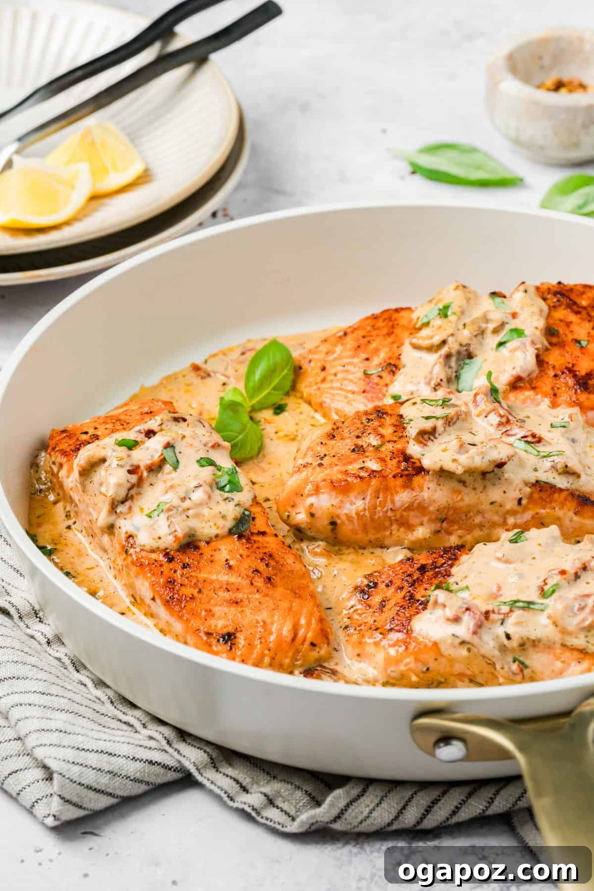 Engagement Salmon 12 Easy Marry Me Salmon with fresh basil garnish in a skillet