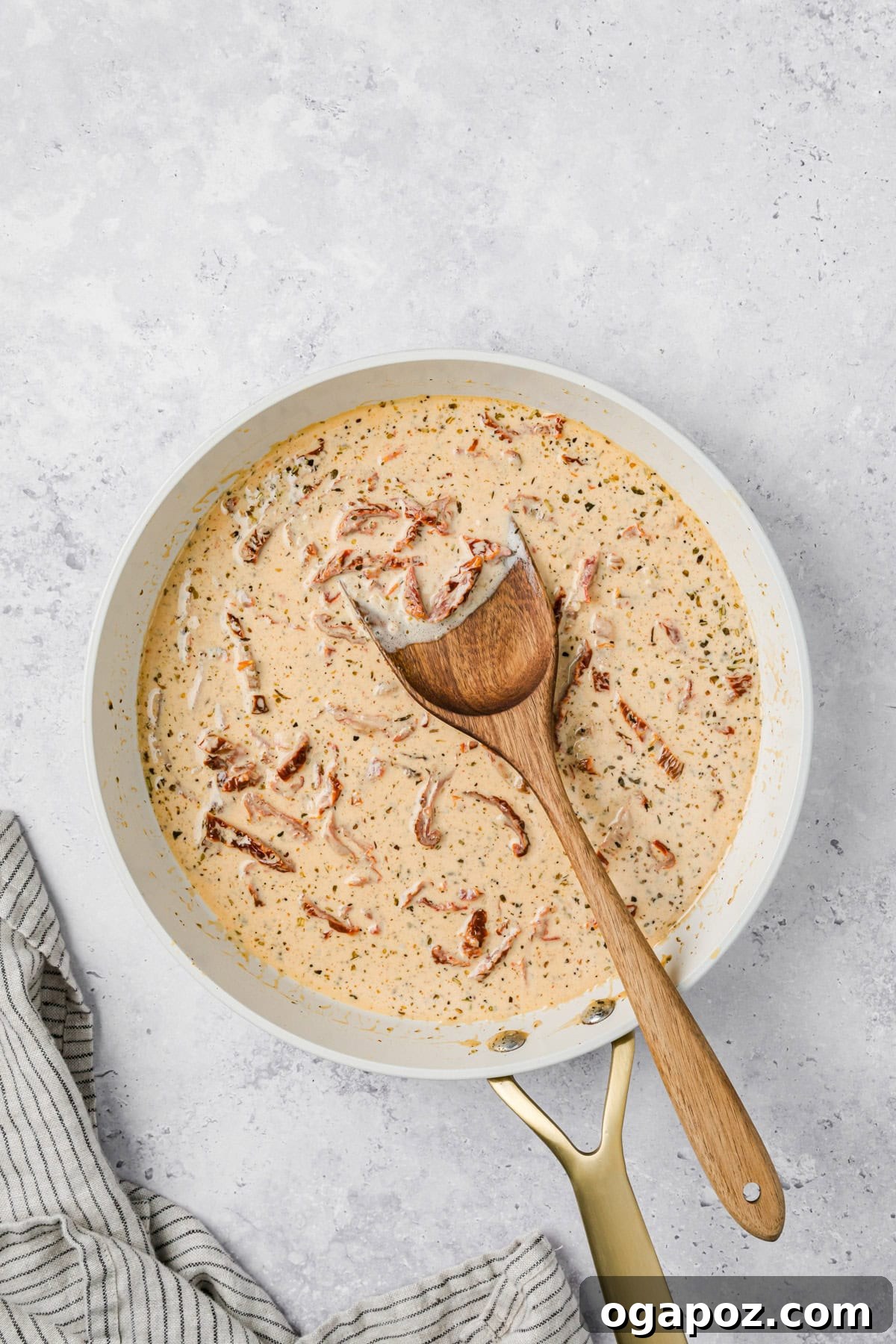 Engagement Salmon 8 Marry Me Sauce simmering in a skillet with a spoon