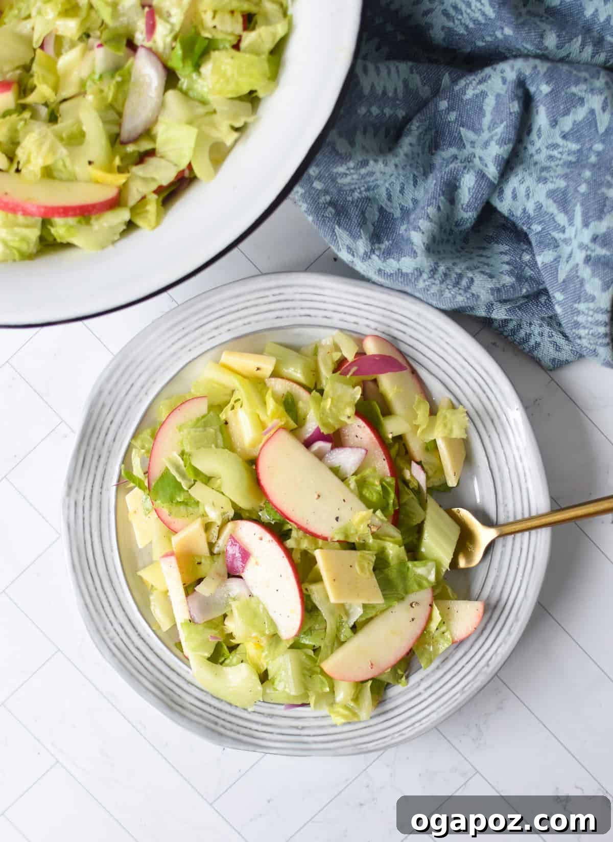 Refreshing Apple Celery Crunch 6 Apple Salad with Celery on a white plate with gold fork