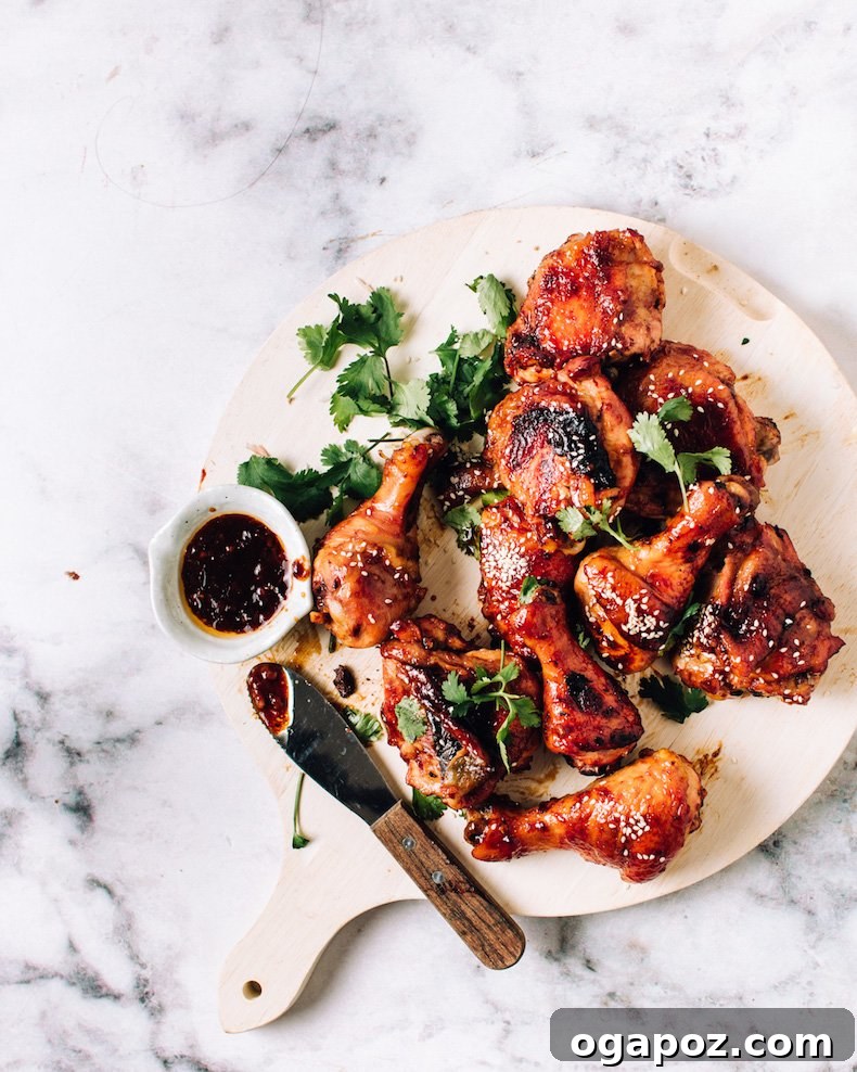 Fall-Off-The-Bone Baked BBQ Chicken Legs 6 Close-up of baked bbq chicken legs with sticky sauce