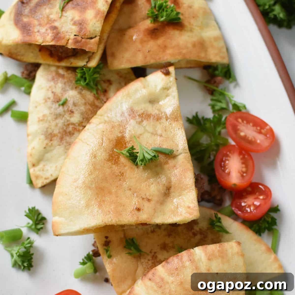 Arayes, Lebanese Meat Stuffed Pitas, cut in half