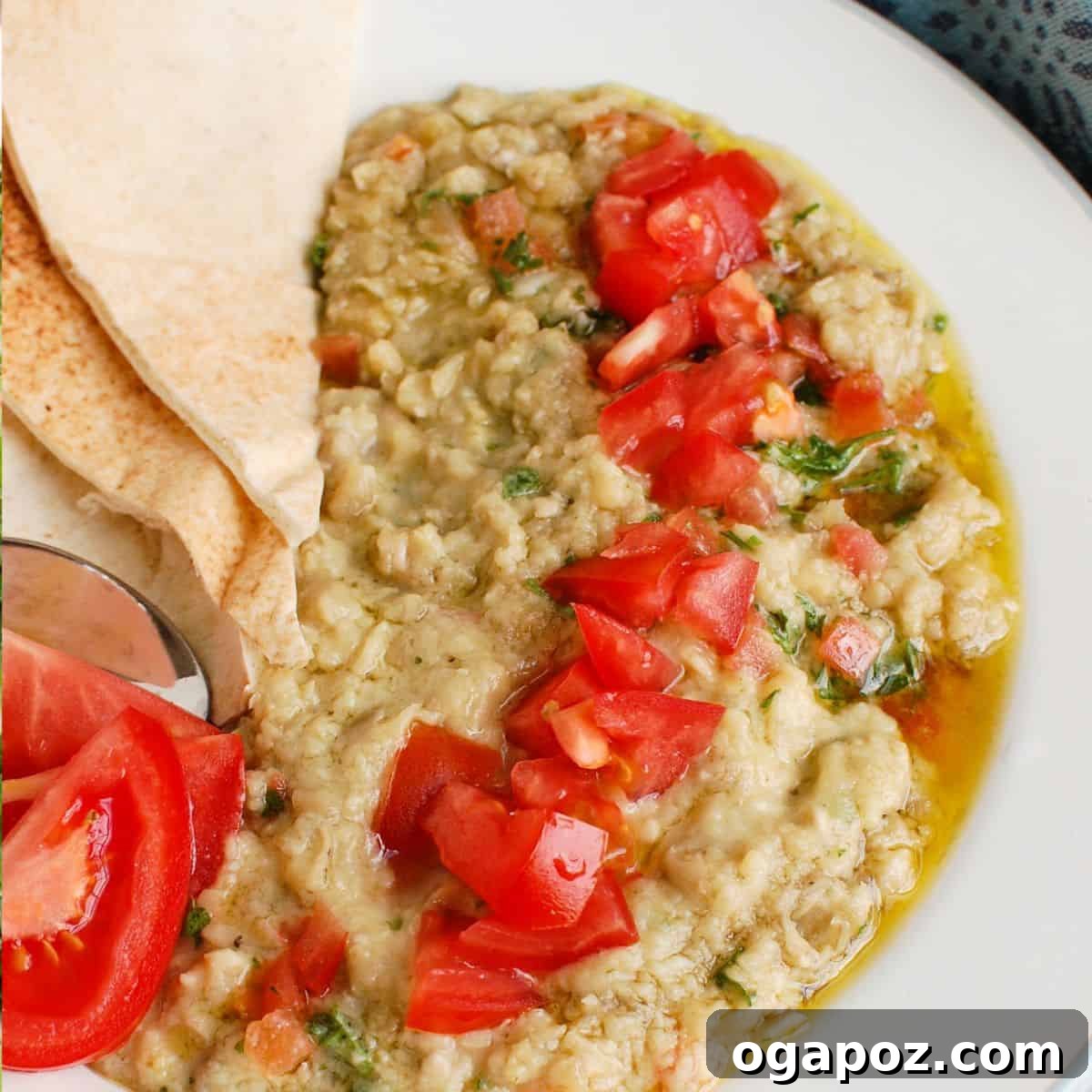 Ful Medames (Fava Bean Dip) garnished with fresh herbs