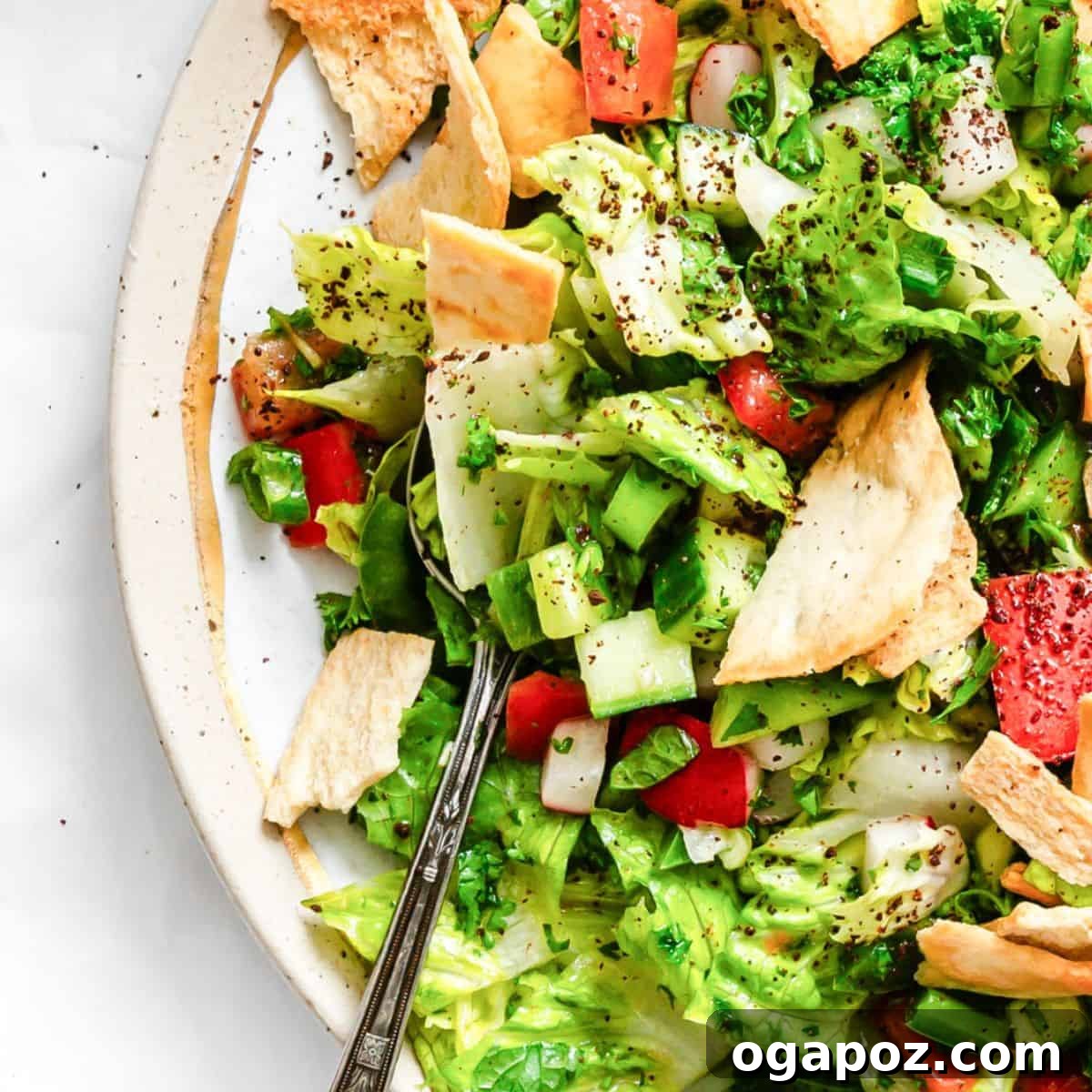 Fresh Fattoush Salad in a serving bowl with pita chips