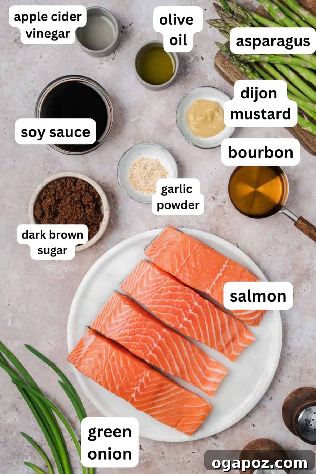 Sticky Bourbon Salmon 5 A flat lay image displaying all the simple ingredients required for Bourbon Glazed Salmon recipe, including salmon fillets, bourbon, brown sugar, soy sauce, and fresh asparagus.