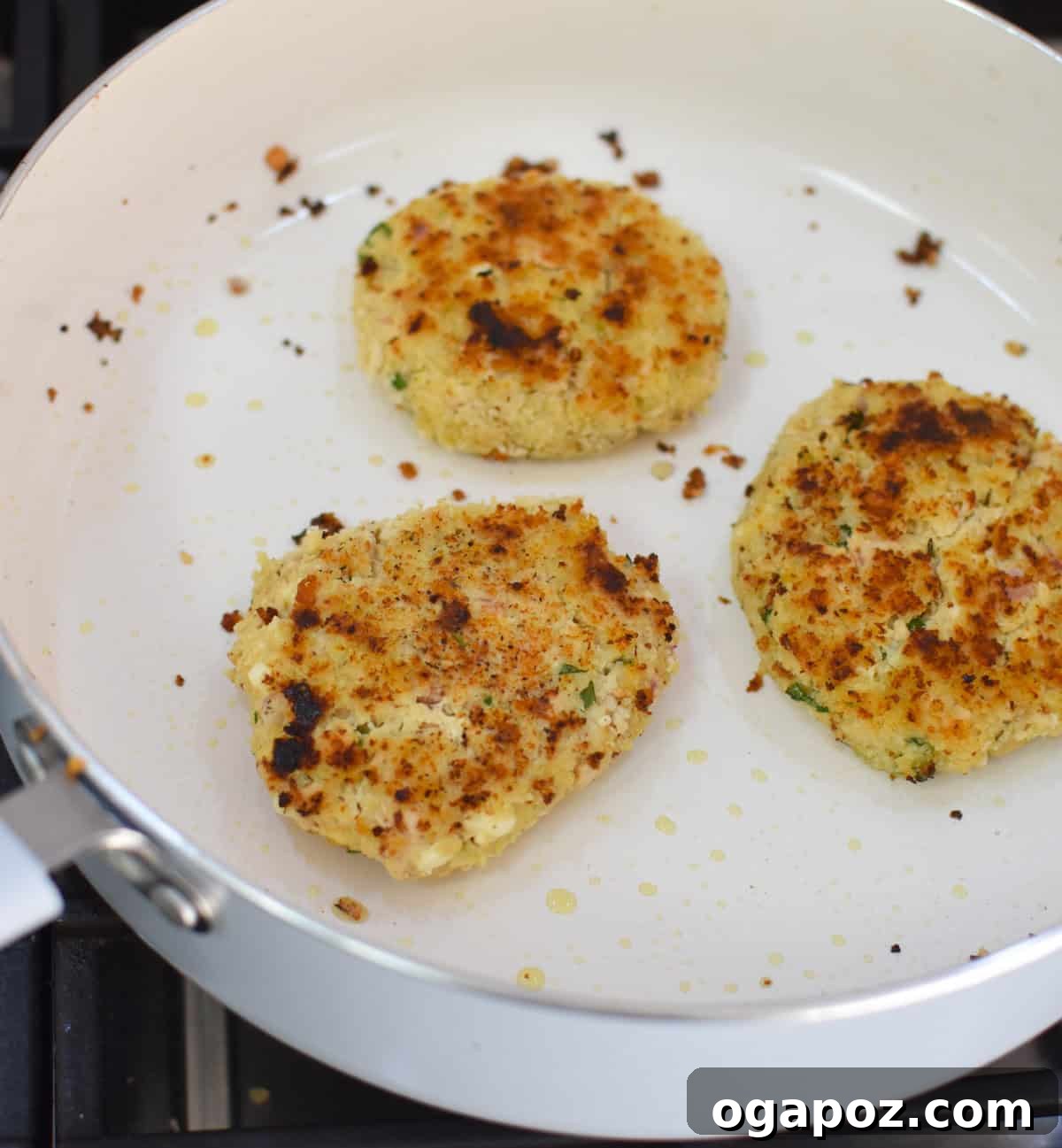 Mediterranean Salmon Cakes recipe in a skillet 