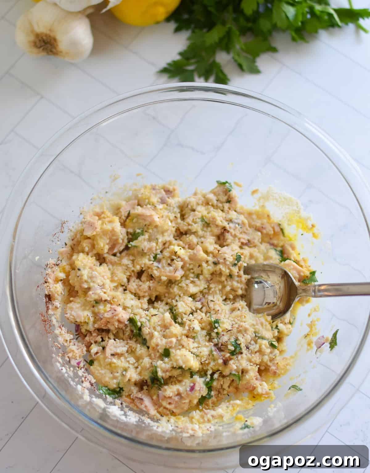 Salmon Patties recipe recipe ingredients mixed in a clear bowl