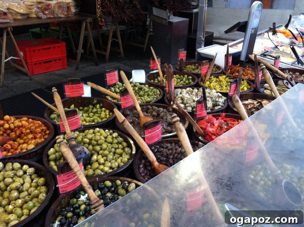 Munich: A Bavarian Jewel 12 An enticing olive bar display at the Viktualienmarkt in Munich, showcasing a variety of marinated olives and antipasti