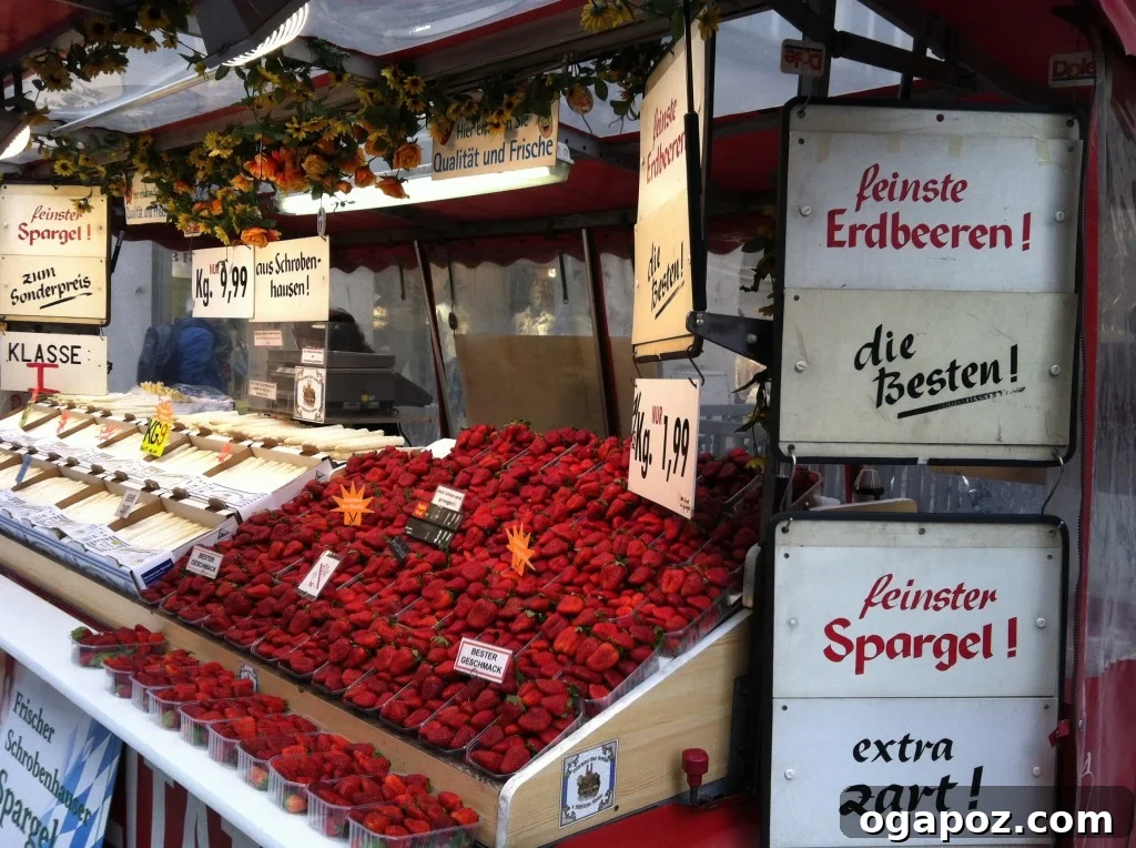 Munich: A Bavarian Jewel 15 Close-up shot of freshly picked strawberries, glistening and ripe, ready for purchase at a market