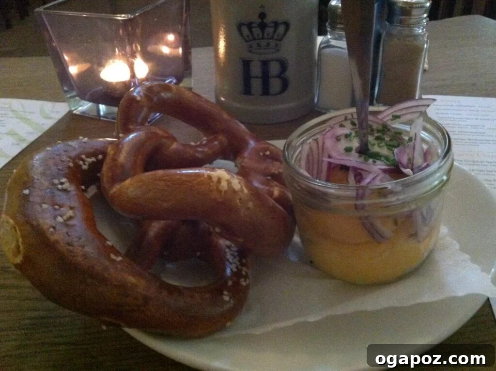 Munich: A Bavarian Jewel 6 Delicious pretzel served with a generous dollop of traditional Obatzda cheese spread, a quintessential Munich snack