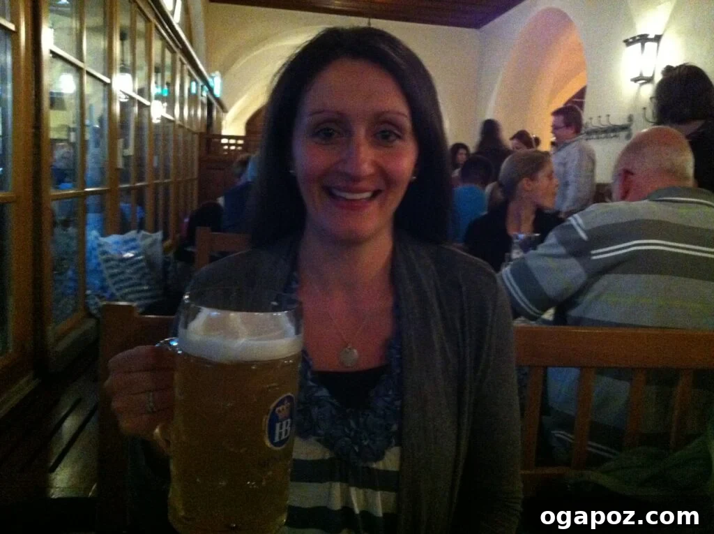 Munich: A Bavarian Jewel 10 A joyful traveler holding a large stein of traditional German beer in a Munich beer hall, smiling broadly