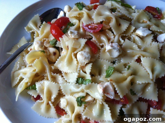 Large bowl of homemade Caprese Pasta Salad, ready to serve