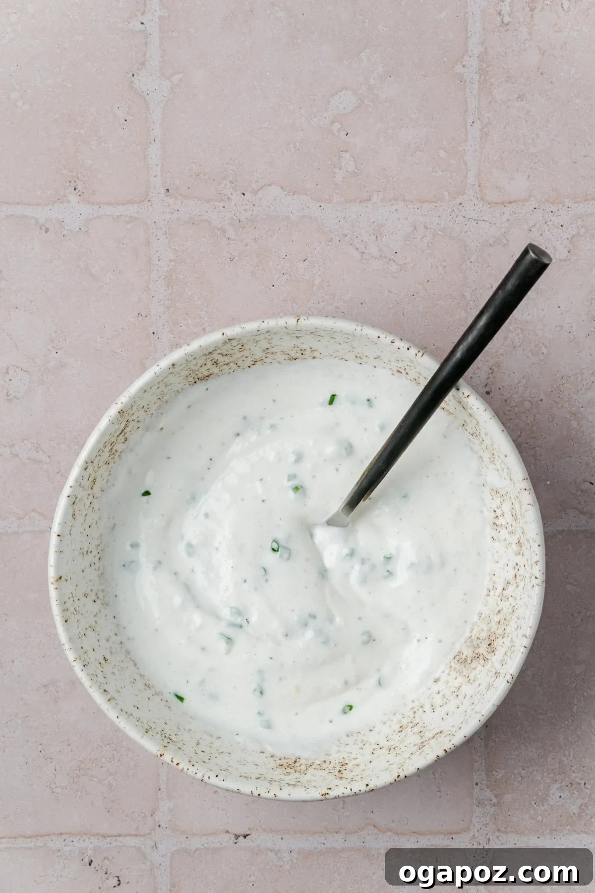 Crispy Garlic Parmesan Smashed Potatoes 13 A bowl of creamy Parmesan Greek Yogurt Dip.