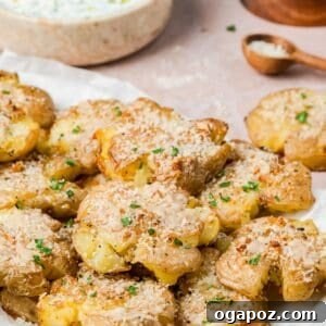 Garlic Parmesan Smashed Potatoes on a wooden board