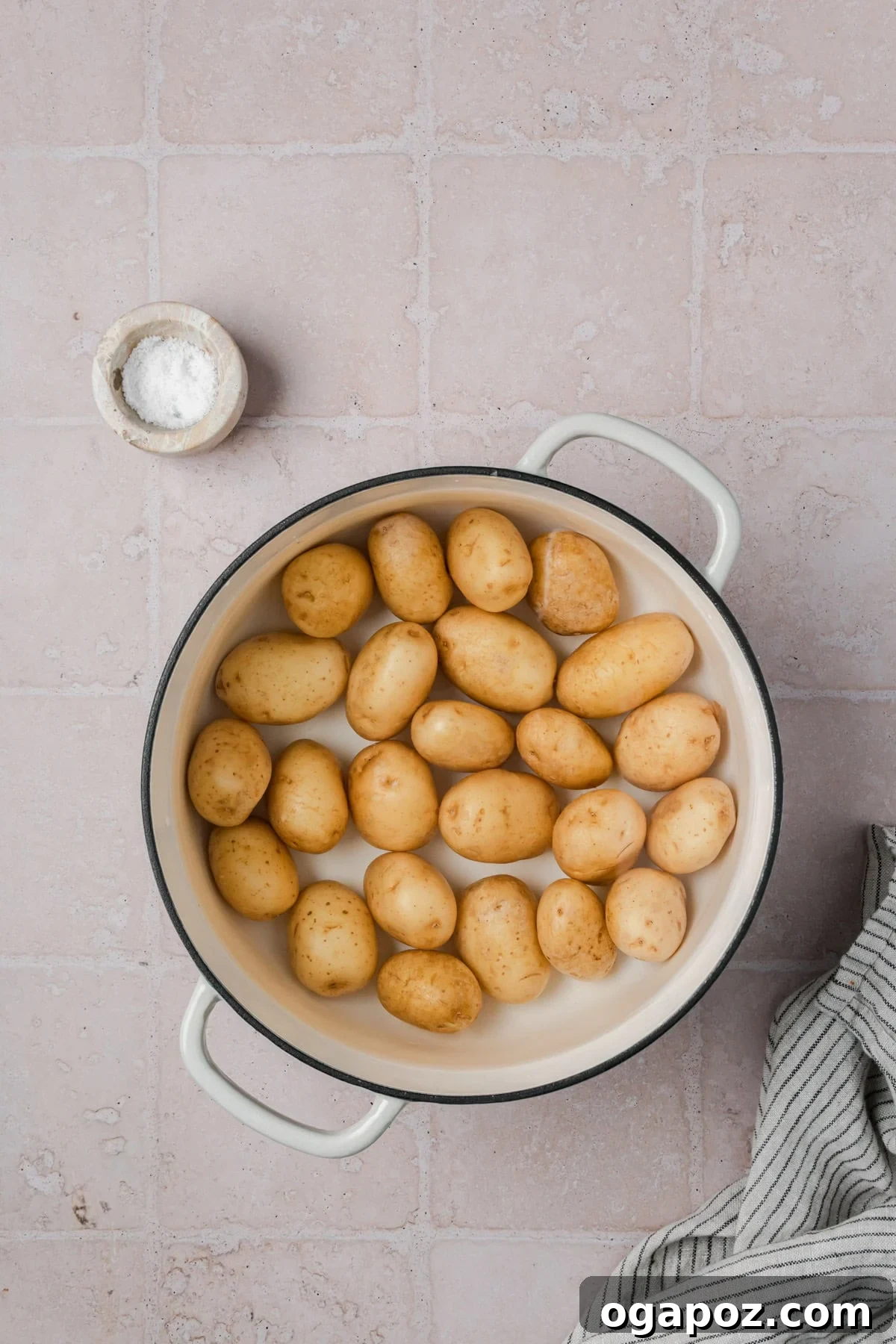 Crispy Garlic Parmesan Smashed Potatoes 9 Potatoes boiling in a pot, ready for the next step.