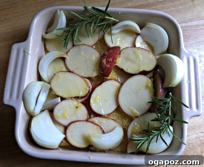 Zesty Rosemary Chicken with Crispy Red Potatoes 3 Preparing Roasted Lemon Rosemary Chicken and Red Potatoes with fresh ingredients before baking
