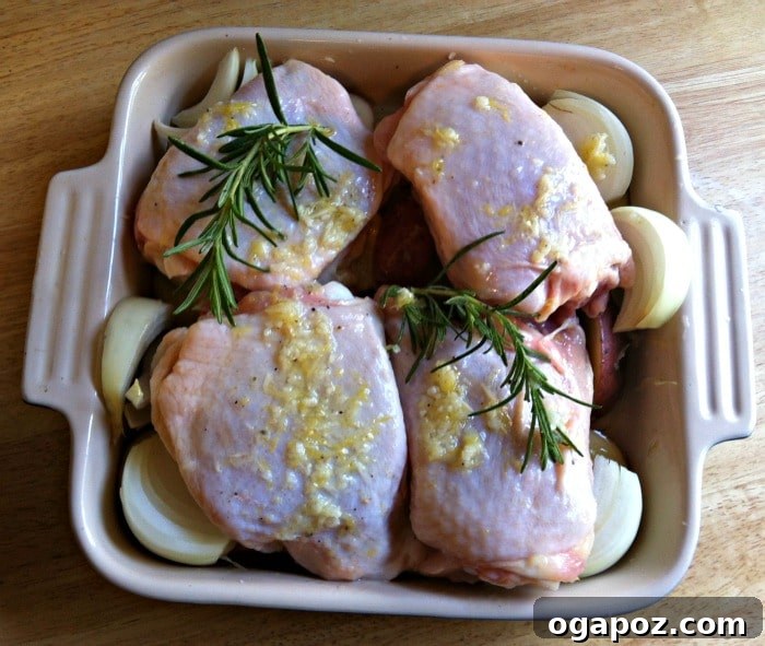 Zesty Rosemary Chicken with Crispy Red Potatoes 4 Roasted Lemon Rosemary Chicken and Red Potatoes ready to bake, seasoned and arranged on a sheet pan