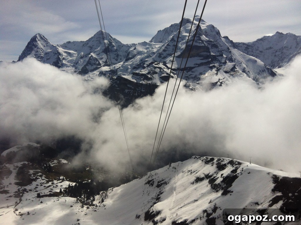Interlaken Swiss Adventure Hub 13 Panoramic view from Shilthorn summit with mountains and clouds