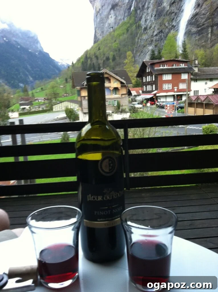 Interlaken Swiss Adventure Hub 5 Relaxing on a patio with wine, overlooking waterfalls in Interlaken, Switzerland