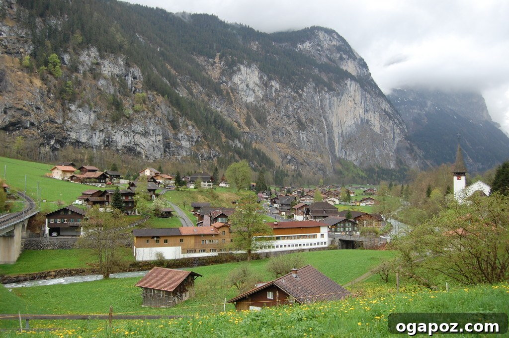Interlaken Swiss Adventure Hub 8 Picturesque countryside in Lauterbrunnen with green fields and distant mountains