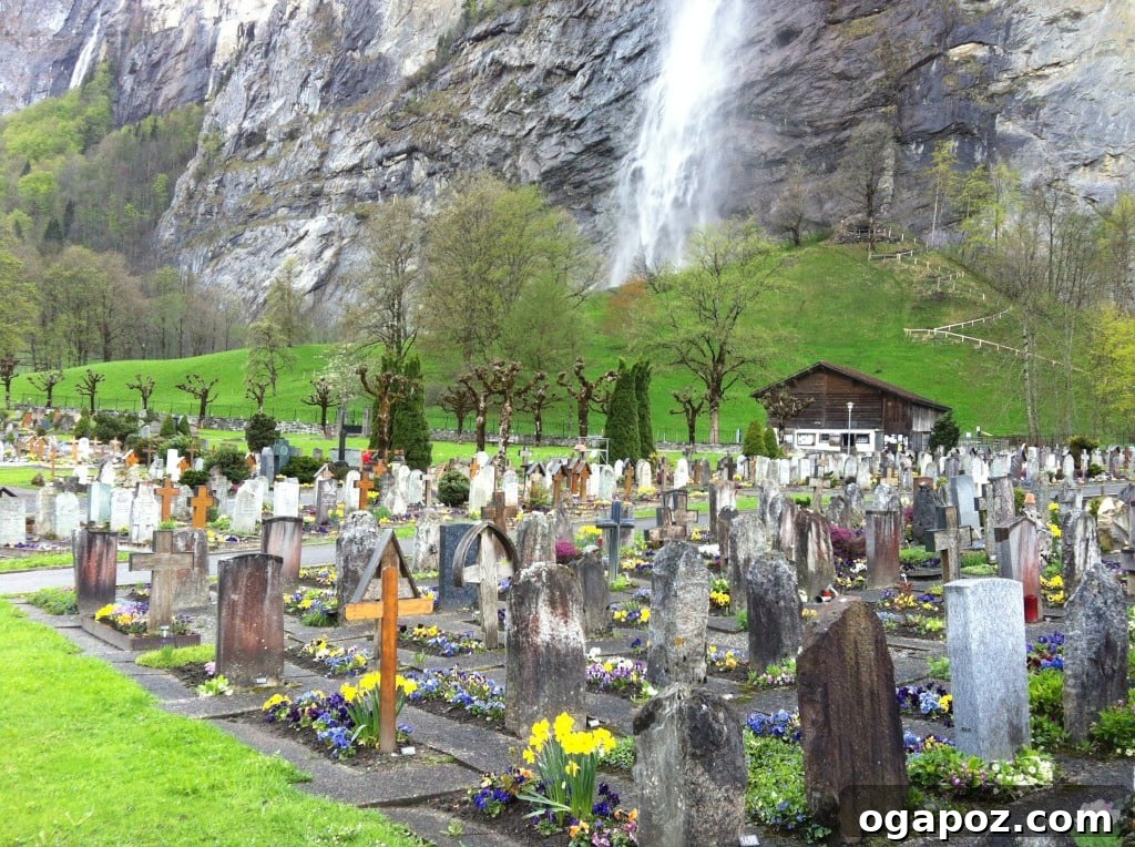 Interlaken Swiss Adventure Hub 9 Cemetery in Lauterbrunnen, surrounded by towering mountains
