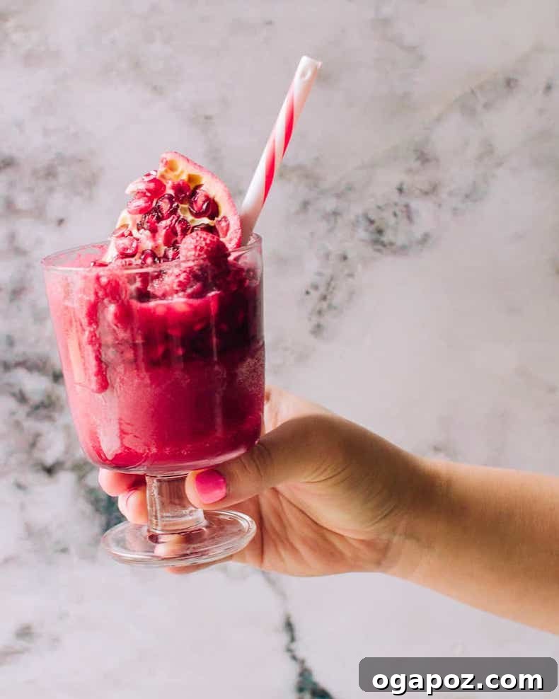 Transform Your Health: 25+ Irresistible Smoothie Creations 11 Beet smoothie in a glass with a red striped straw