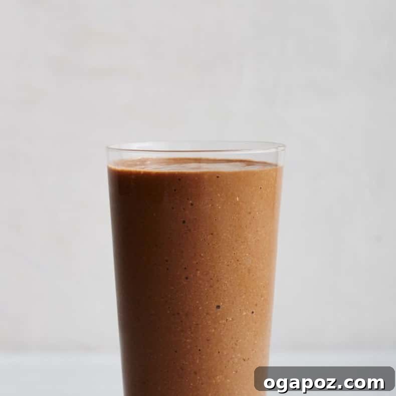 Transform Your Health: 25+ Irresistible Smoothie Creations 13 Coffee smoothie in a glass with coffee beans