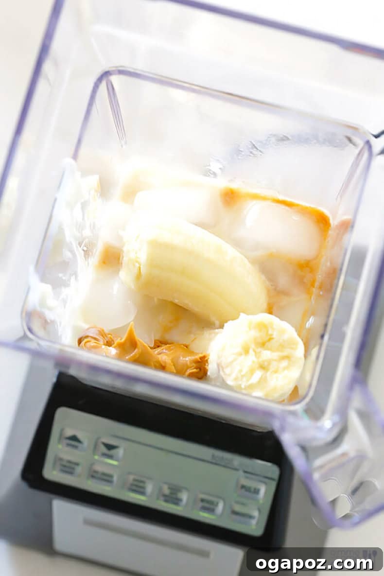 Transform Your Health: 25+ Irresistible Smoothie Creations 14 Peanut butter and banana in a blender, ready to be blended into a smoothie