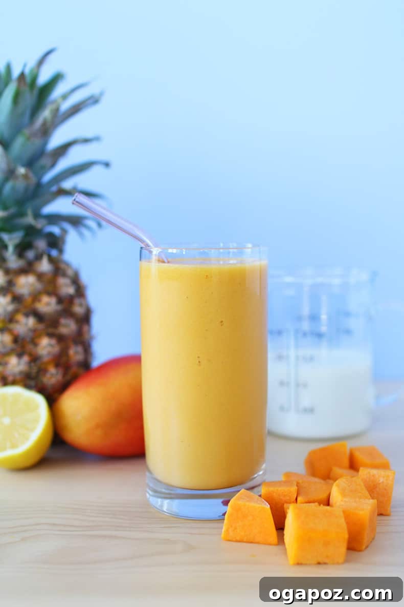 Transform Your Health: 25+ Irresistible Smoothie Creations 21 Pineapple, mango, and butternut squash beside a smoothie glass