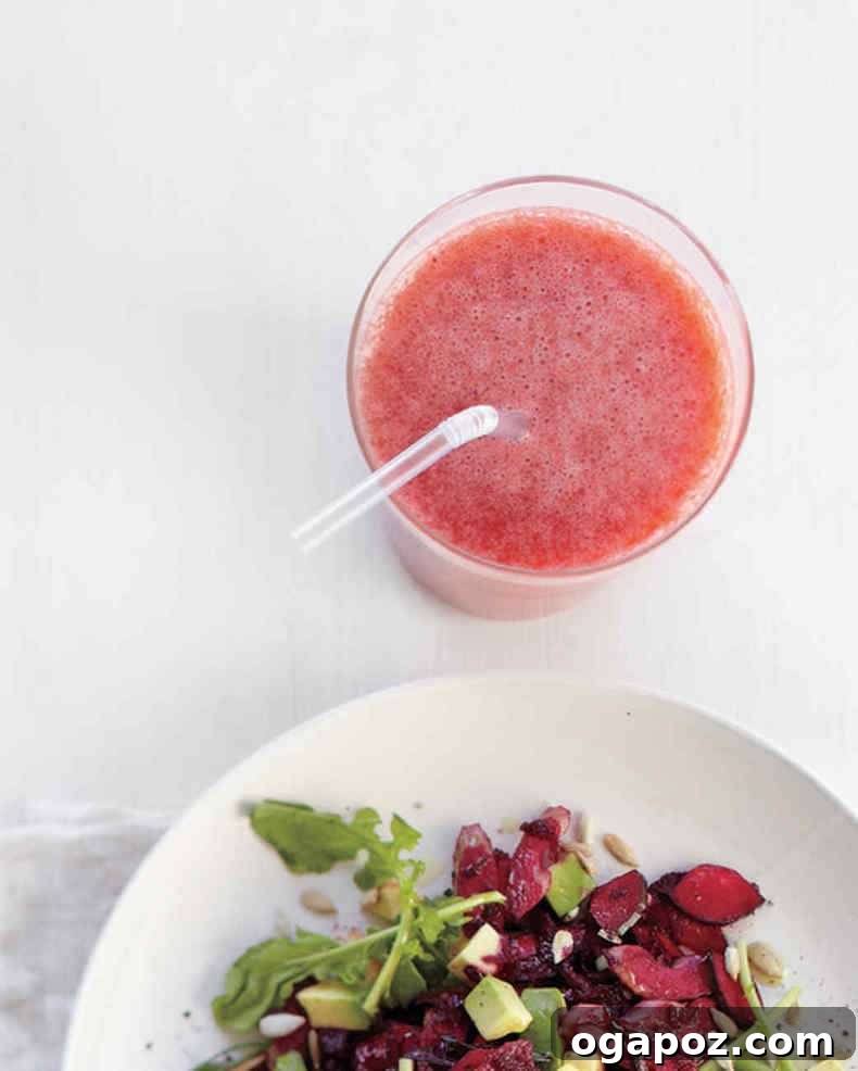 Transform Your Health: 25+ Irresistible Smoothie Creations 7 Strawberry grapefruit smoothie with a plate of crisp salad in the background