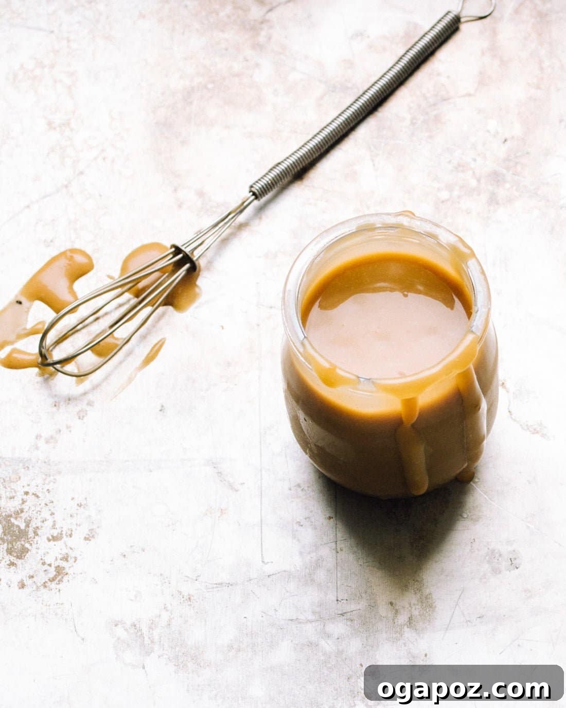 Velvety Asian Salad Dressing 4 Homemade creamy Asian dressing elegantly presented in a small glass jar, signifying its readiness for use or storage.