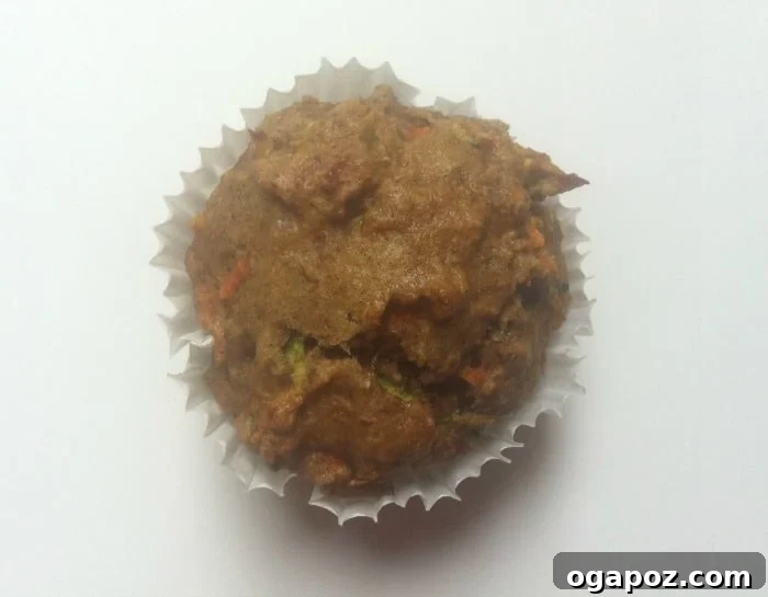Wholesome Carrot Zucchini Muffins for Little Ones 4 Freshly baked Carrot Zucchini Muffins on a cooling rack