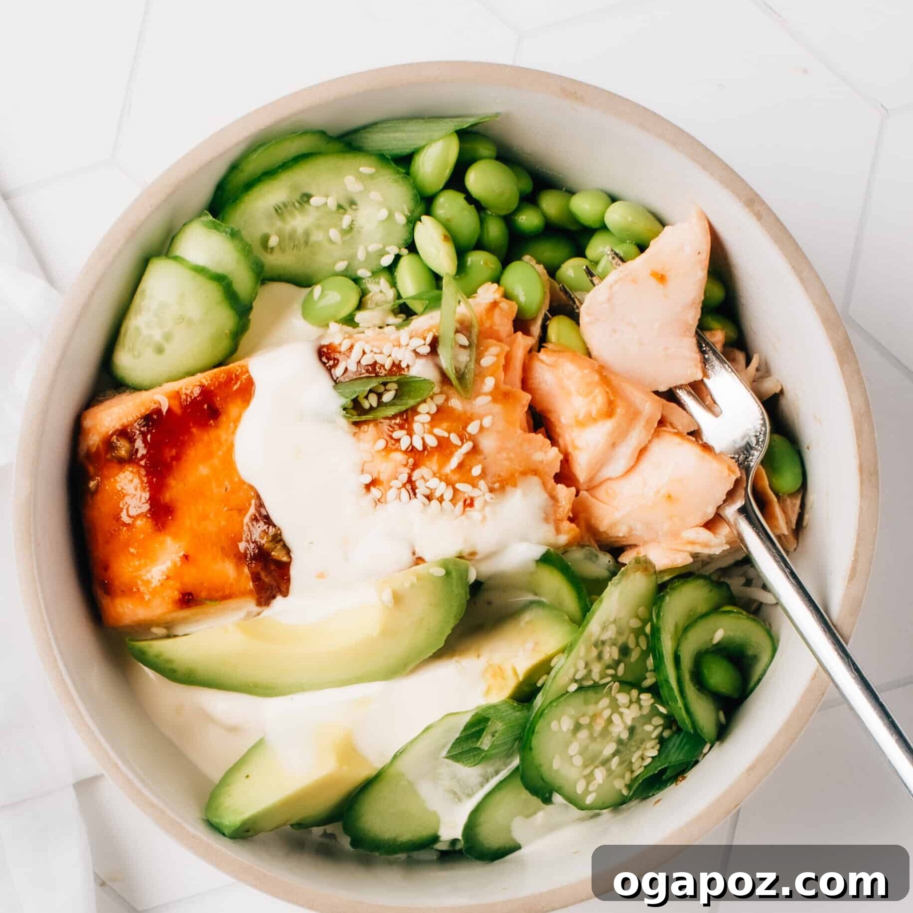 Velvety Asian Salad Dressing 5 A vibrant Honey Teriyaki Salmon Bowl, featuring fresh green vegetables and a generous drizzle of the irresistible creamy Asian dressing.